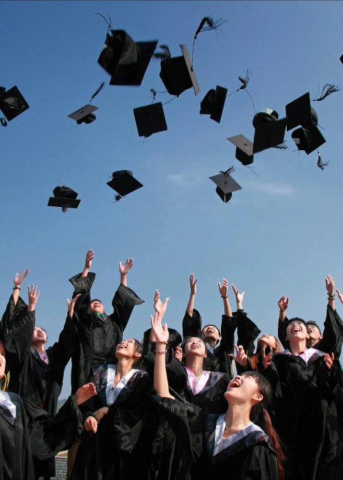 Student throwing graduation hat